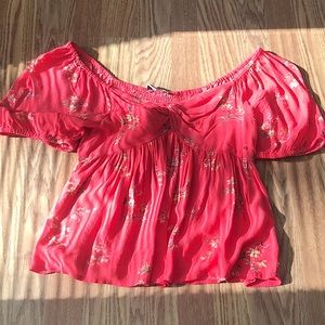 Pink with flowers American eagle shirt.